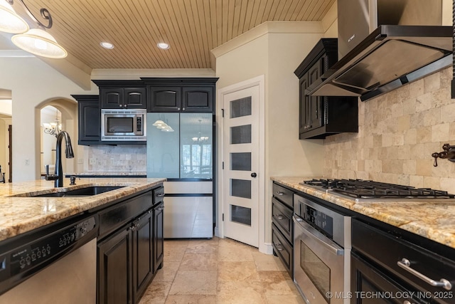 9314 N 96th E Ave, Owasso, OK 74055 - kitchen featuring stainless steel appliances, wall chimney range hood, arched walkways, backsplash, and wood ceiling