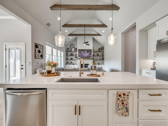 13642 S 21st Pl E, Bixby, OK 74008 - kitchen with appliances with stainless steel finishes, open floor plan, white cabinetry, a ceiling fan, and light stone counters