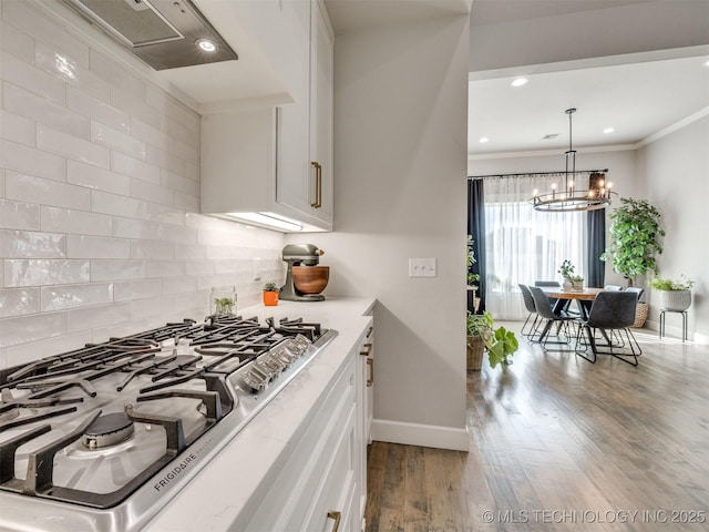 13642 S 21st Pl E, Bixby, OK 74008 - kitchen featuring stainless steel gas cooktop, ventilation hood, white cabinetry, crown molding, and recessed lighting