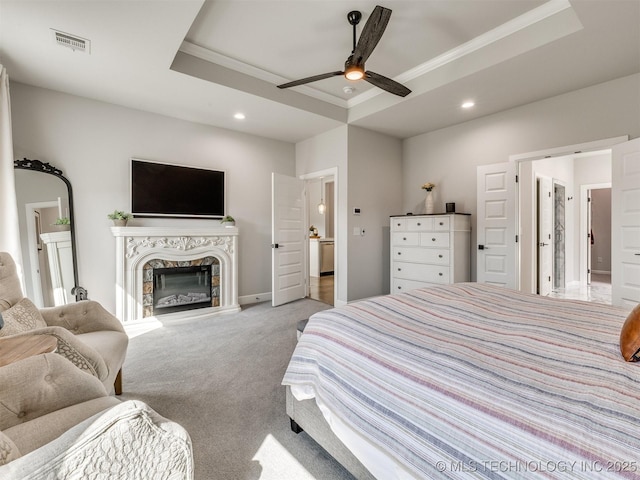 13642 S 21st Pl E, Bixby, OK 74008 - carpeted bedroom with a raised ceiling, crown molding, recessed lighting, a premium fireplace, and ceiling fan