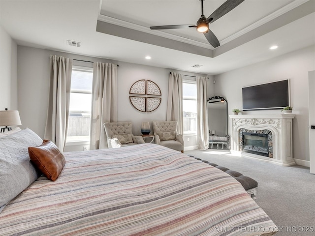 13642 S 21st Pl E, Bixby, OK 74008 - bedroom featuring a tray ceiling, ornamental molding, multiple windows, carpet flooring, and recessed lighting