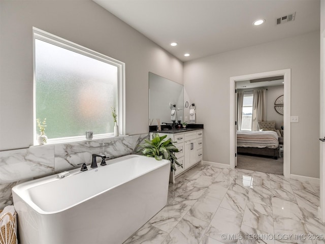 13642 S 21st Pl E, Bixby, OK 74008 - full bathroom with vanity, ensuite bath, a freestanding tub, recessed lighting, and marble finish floors