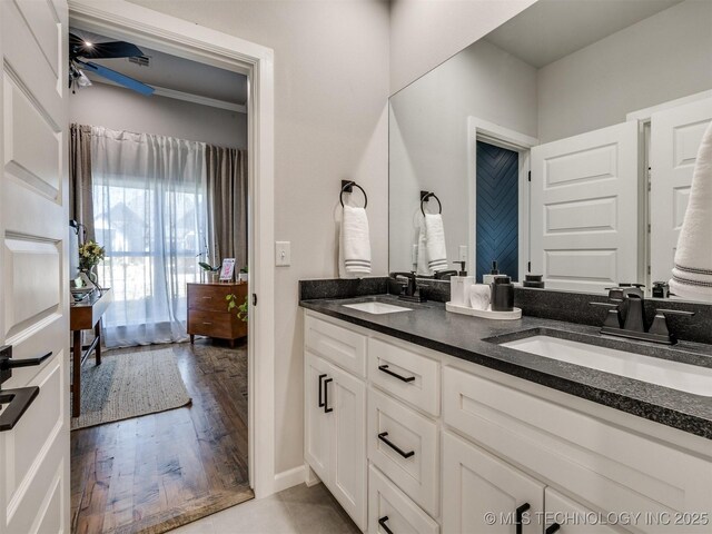13642 S 21st Pl E, Bixby, OK 74008 - full bathroom featuring double vanity, wood finished floors, and ceiling fan