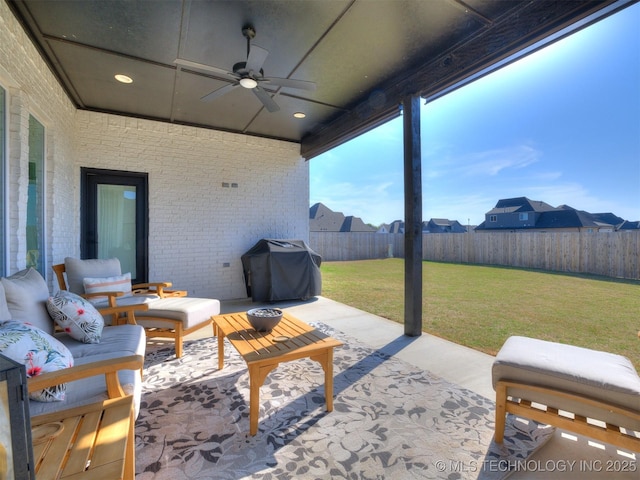 13642 S 21st Pl E, Bixby, OK 74008 - fenced backyard with area for grilling, ceiling fan, a patio, and an outdoor hangout area