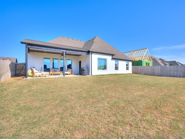 13642 S 21st Pl E, Bixby, OK 74008 - back of house with ceiling fan, an outdoor hangout area, a fenced backyard, and a patio area