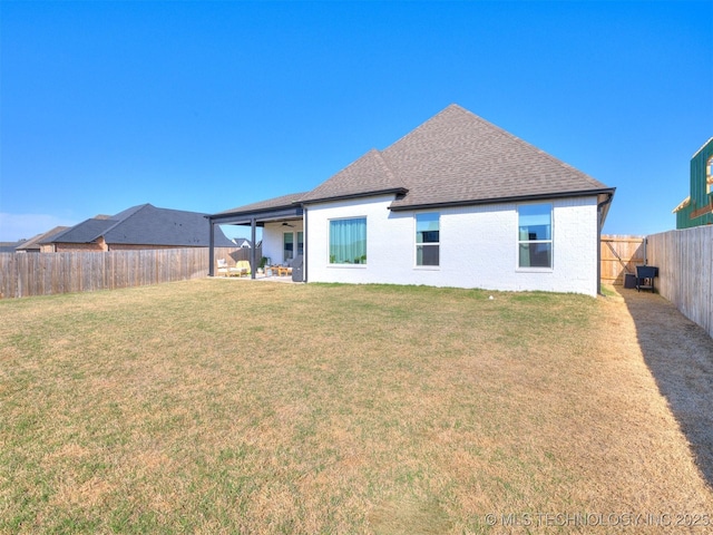 13642 S 21st Pl E, Bixby, OK 74008 - back of property with a ceiling fan, a fenced backyard, roof with shingles, and a patio
