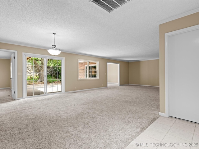 1525 Pecan Pl, Bartlesville, OK 74003 - unfurnished room featuring light colored carpet and a textured ceiling