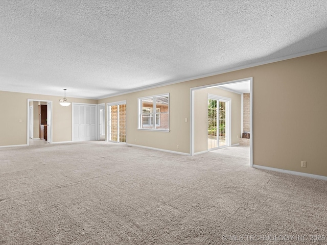 1525 Pecan Pl, Bartlesville, OK 74003 - empty room with a textured ceiling and carpet floors