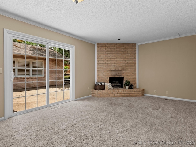 1525 Pecan Pl, Bartlesville, OK 74003 - unfurnished living room with a textured ceiling, crown molding, a fireplace, and carpet floors