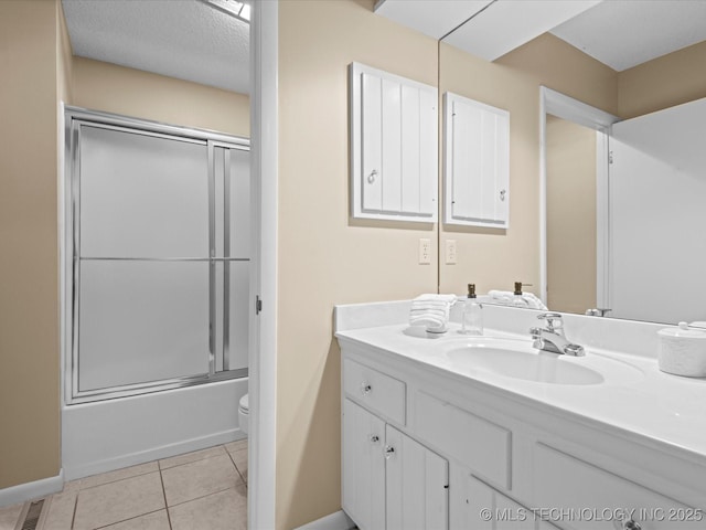 1525 Pecan Pl, Bartlesville, OK 74003 - bathroom with vanity, tile patterned flooring, and enclosed tub / shower combo