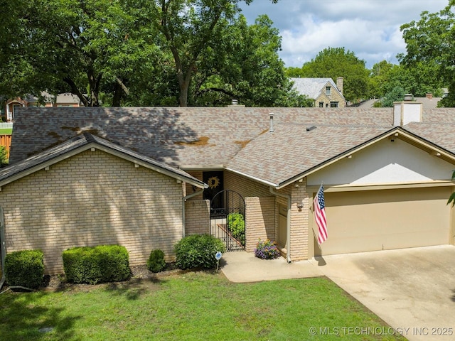 1525 Pecan Pl, Bartlesville, OK 74003 - view of front of house with a shingled roof, a garage, brick siding, a front yard, and driveway