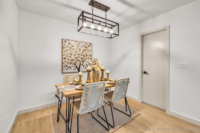 4235 E 104th St, Tulsa, OK 74137 - dining space with light wood-style floors and a chandelier