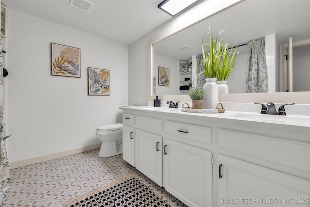 4235 E 104th St, Tulsa, OK 74137 - bathroom with double vanity and toilet