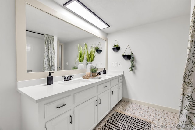 4235 E 104th St, Tulsa, OK 74137 - bathroom featuring double vanity and baseboards