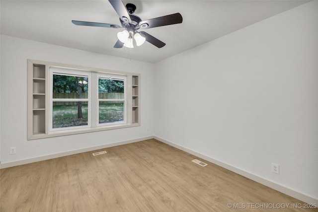 4235 E 104th St, Tulsa, OK 74137 - empty room with a ceiling fan and wood finished floors