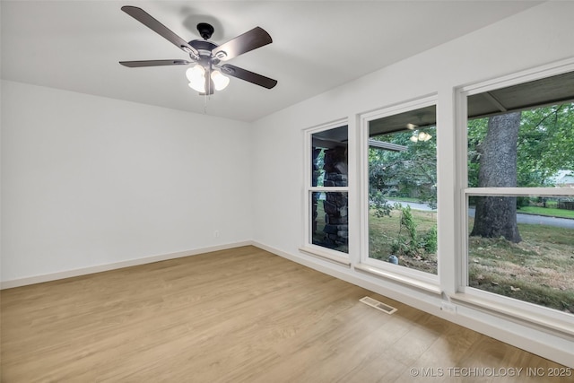 4235 E 104th St, Tulsa, OK 74137 - empty room with light wood-style floors and a ceiling fan