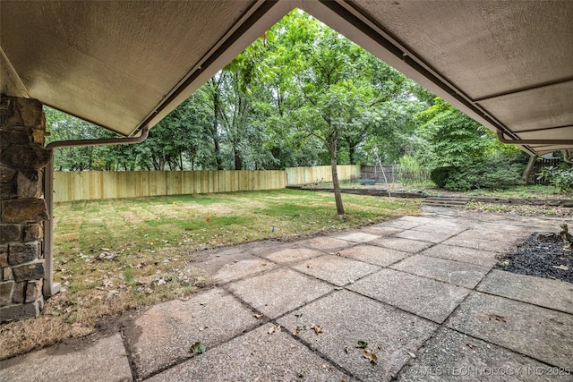 4235 E 104th St, Tulsa, OK 74137 - fenced backyard with a patio area