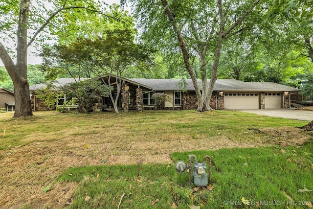 4235 E 104th St, Tulsa, OK 74137 - view of front of property featuring stone siding, a garage, driveway, and a front yard