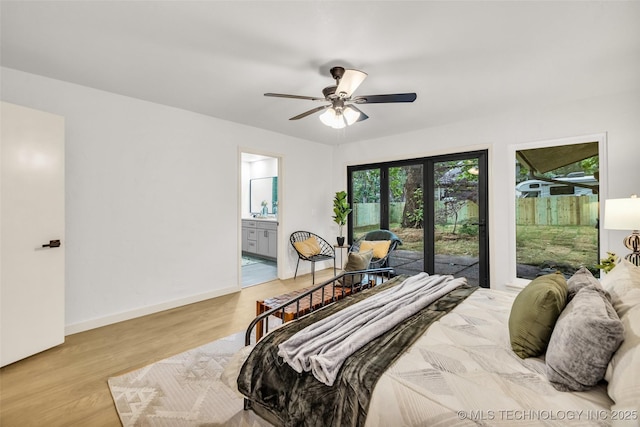 4235 E 104th St, Tulsa, OK 74137 - bedroom with access to outside, connected bathroom, wood finished floors, and a ceiling fan