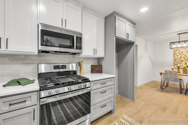 4235 E 104th St, Tulsa, OK 74137 - kitchen with appliances with stainless steel finishes, light countertops, backsplash, light wood-style flooring, and recessed lighting