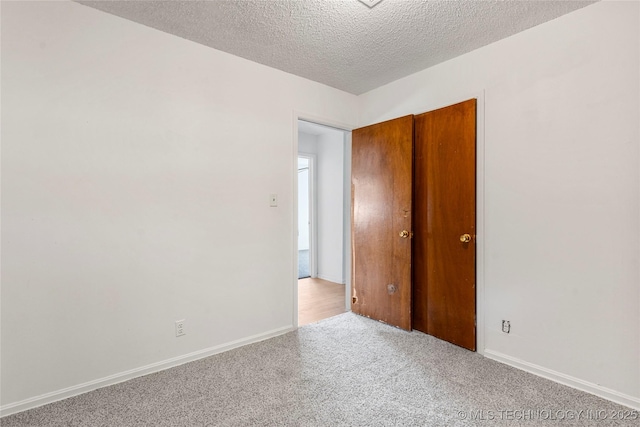 3344 S 120th E Ave, Tulsa, OK 74146 - spare room with light colored carpet and a textured ceiling