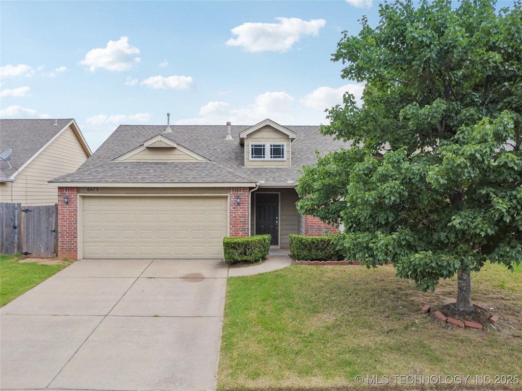 6673 E 129th St S, Bixby, OK 74008 - view of front of home with brick siding, driveway, a garage, and a shingled roof