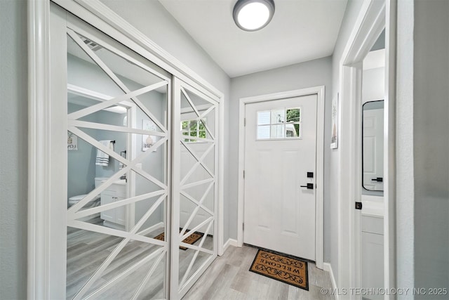412 W Roger St, Oilton, OK 74052 - doorway featuring wood finished floors and baseboards