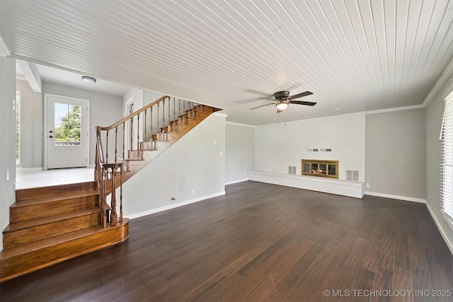 412 W Roger St, Oilton, OK 74052 - unfurnished living room with ceiling fan, stairs, dark wood finished floors, wooden ceiling, and a glass covered fireplace