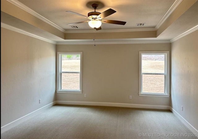 2889 Forest View Dr, Claremore, OK 74017 - spare room featuring a tray ceiling, carpet, a ceiling fan, and ornamental molding