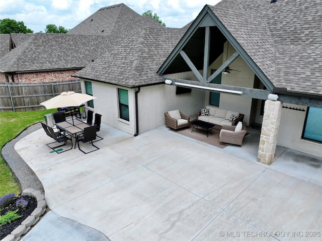 2889 Forest View Dr, Claremore, OK 74017 - back of house featuring an outdoor hangout area, roof with shingles, a patio, outdoor dining area, and brick siding