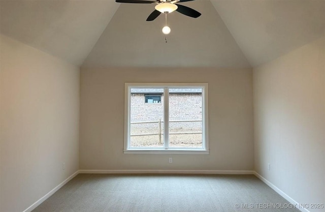 2889 Forest View Dr, Claremore, OK 74017 - carpeted empty room with vaulted ceiling and ceiling fan