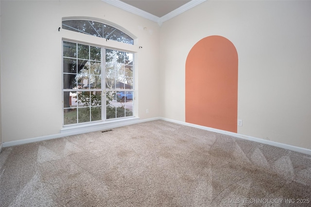 16304 Bandera, Oklahoma City, OK 73013 - empty room with carpet flooring, ornamental molding, and arched walkways