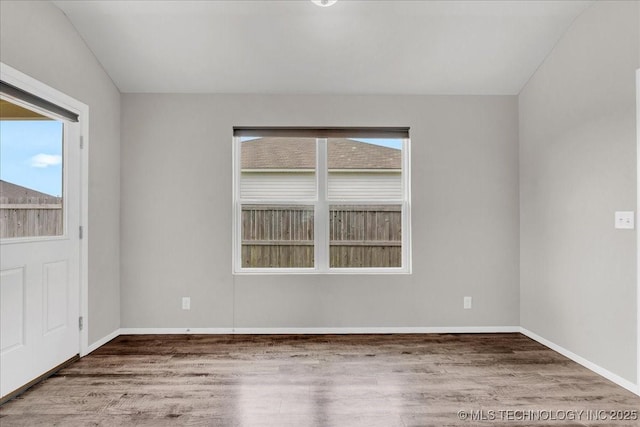 3729 S 150th E Ave, Tulsa, OK 74134 - empty room with plenty of natural light and wood finished floors