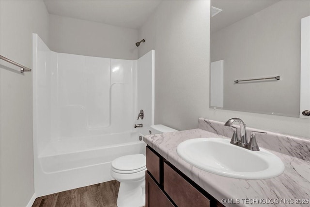 3729 S 150th E Ave, Tulsa, OK 74134 - bathroom with vanity, wood finished floors, and washtub / shower combination