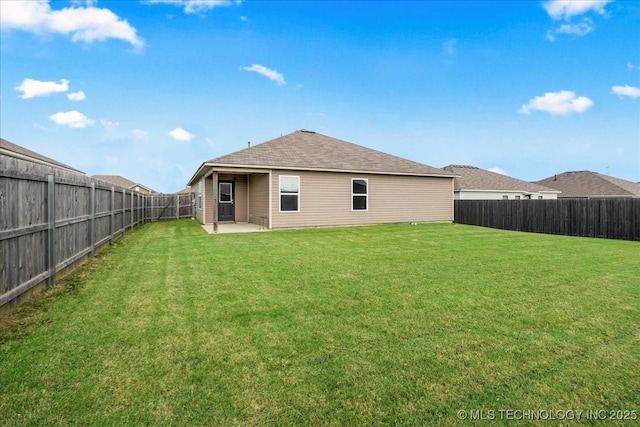 3729 S 150th E Ave, Tulsa, OK 74134 - rear view of house with a fenced backyard, a patio area, and a shingled roof