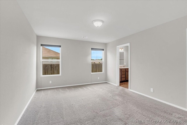 3729 S 150th E Ave, Tulsa, OK 74134 - unfurnished bedroom featuring carpet and ensuite bathroom
