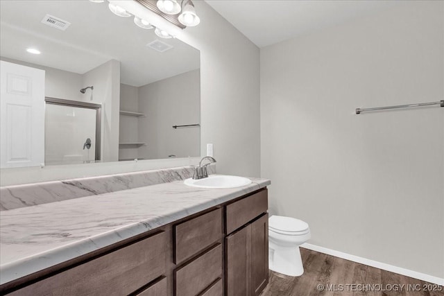 3729 S 150th E Ave, Tulsa, OK 74134 - full bath featuring wood finished floors, vanity, and a shower with door