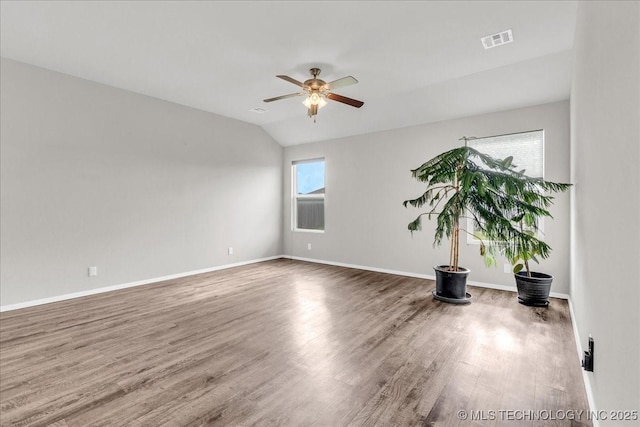 3729 S 150th E Ave, Tulsa, OK 74134 - spare room with a ceiling fan, wood finished floors, and vaulted ceiling