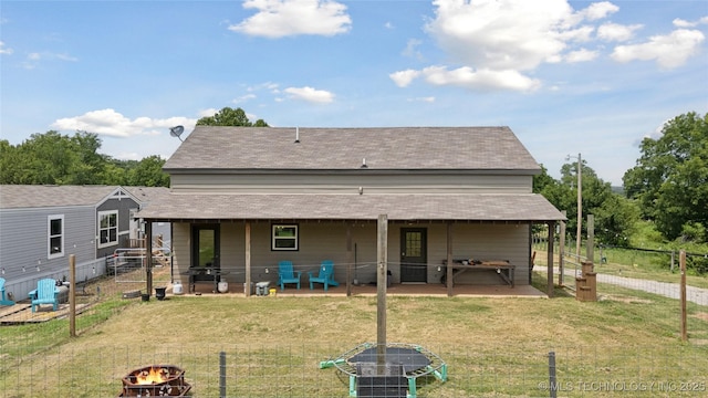 32528 W 261st St S, Bristow, OK 74010 - back of house with an outdoor fire pit, a patio area, and roof with shingles