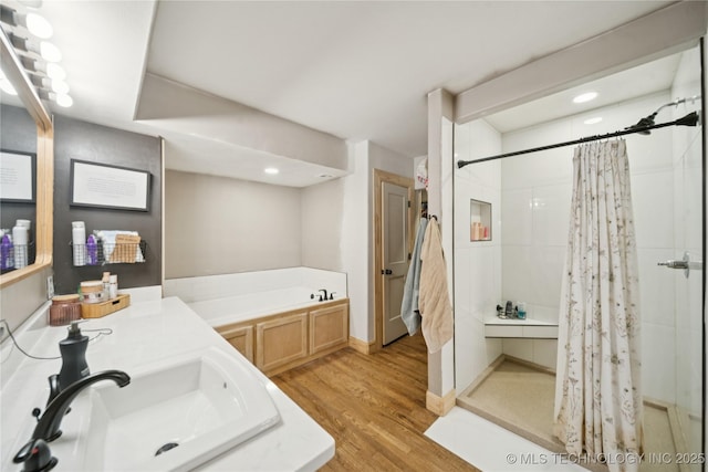 32528 W 261st St S, Bristow, OK 74010 - full bathroom featuring a shower stall, a garden tub, wood finished floors, recessed lighting, and vanity