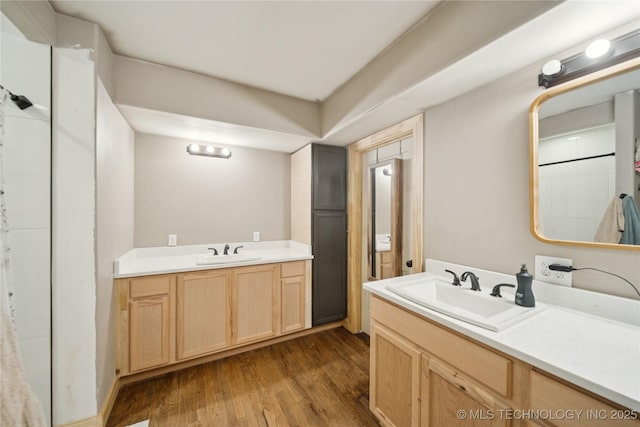 32528 W 261st St S, Bristow, OK 74010 - bathroom featuring two vanities and wood finished floors