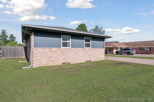 208 N Davis Ave W, Claremore, OK 74017 - view of home's exterior featuring brick siding, crawl space, and driveway