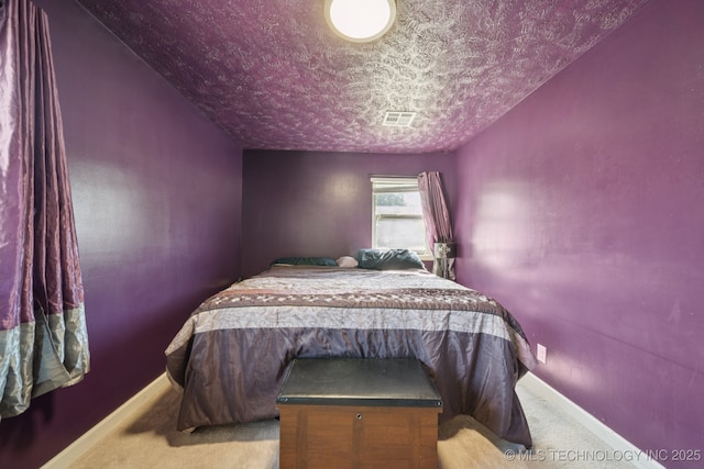 208 N Davis Ave W, Claremore, OK 74017 - bedroom featuring carpet flooring and a textured ceiling