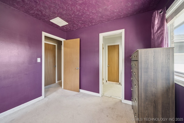 208 N Davis Ave W, Claremore, OK 74017 - unfurnished bedroom with baseboards and carpet flooring