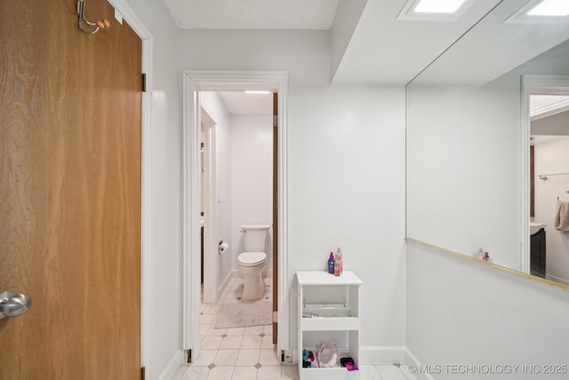 208 N Davis Ave W, Claremore, OK 74017 - bathroom with toilet and baseboards