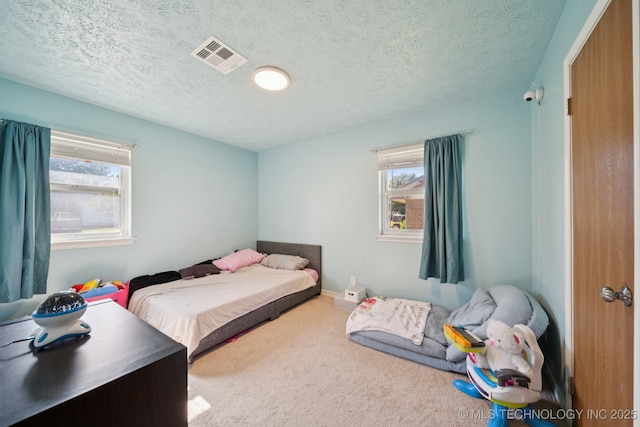 208 N Davis Ave W, Claremore, OK 74017 - bedroom with carpet floors and a textured ceiling