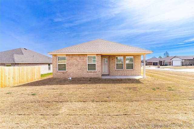 304 S 25th St, Collinsville, OK 74021 - view of front of house with brick siding, a patio area, and a shingled roof