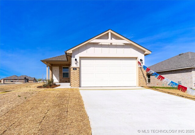 304 S 25th St, Collinsville, OK 74021 - single story home featuring brick siding, concrete driveway, board and batten siding, and a garage