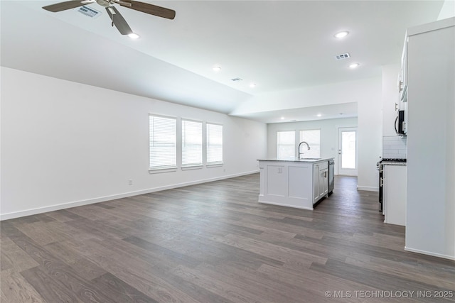 304 S 25th St, Collinsville, OK 74021 - unfurnished living room with ceiling fan, dark wood finished floors, recessed lighting, and vaulted ceiling