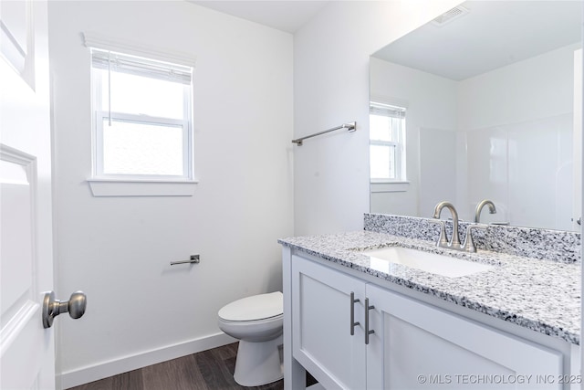 304 S 25th St, Collinsville, OK 74021 - bathroom featuring vanity and wood finished floors